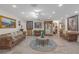 Expansive living room featuring luxurious leather seating, decorative art, and ample space for gatherings at 2704 Dorene Dr, Plant City, FL 33563