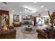 A cozy living room features a brick fireplace, elegant furnishings, and an open layout at 2704 Dorene Dr, Plant City, FL 33563