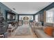 Inviting living room with a large tv, comfortable seating, and an open view to the dining area at 2704 Dorene Dr, Plant City, FL 33563