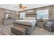 Main bedroom featuring a decorative ceiling fan, a large bed, and plenty of natural light at 2704 Dorene Dr, Plant City, FL 33563