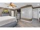 Spacious main bedroom features a decorative bed, plenty of furnishings, and a TV at 2704 Dorene Dr, Plant City, FL 33563