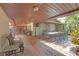 Expansive covered patio with dining and lounging areas, ideal for entertaining and enjoying outdoor living at 2704 Dorene Dr, Plant City, FL 33563