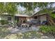 Outdoor patio with comfortable seating, a brick fire pit, and ample space for entertaining guests at 2704 Dorene Dr, Plant City, FL 33563