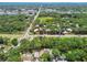 An aerial shot highlights neighborhood and local road, surrounded by lush greenery and landscaping at 2742 Wilson Ct, Palm Harbor, FL 34684