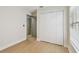 Bedroom showcasing a closet, wood-look floors, and a window with horizontal blinds at 2742 Wilson Ct, Palm Harbor, FL 34684