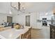 View of open-concept living spaces, including the dining and kitchen areas and a seating area at 2742 Wilson Ct, Palm Harbor, FL 34684