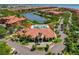 Stunning aerial view of the clubhouse, pool, and beautiful landscaping in this luxurious waterfront community at 2773 Via Cipriani # 1310A, Clearwater, FL 33764