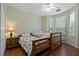 Bedroom showcasing wooden bunk beds, a side table, and plenty of natural light at 2773 Via Cipriani # 1310A, Clearwater, FL 33764
