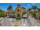 Grand entrance to Bay Watch community featuring a secure gate and beautifully landscaped grounds at 2773 Via Cipriani # 1310A, Clearwater, FL 33764