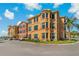Charming condo building featuring lush greenery and ample natural light at 2773 Via Cipriani # 1310A, Clearwater, FL 33764