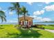 Beautiful gazebo with water views surrounded by lush landscaping, perfect for relaxation at 2773 Via Cipriani # 1310A, Clearwater, FL 33764