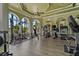 Spacious gym featuring modern exercise machines and a view overlooking the pool at 2773 Via Cipriani # 1310A, Clearwater, FL 33764