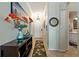 Elegant hallway featuring stylish decor, tile flooring, and an open view into the bathroom at 2773 Via Cipriani # 1310A, Clearwater, FL 33764