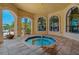 Hot tub area with arches, windows, and views of the pool and surrounding landscape at 2773 Via Cipriani # 1310A, Clearwater, FL 33764