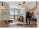 Well-lit kitchen with stainless steel appliances, granite countertops, and a window with a water view at 2773 Via Cipriani # 1310A, Clearwater, FL 33764