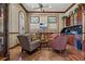 Cozy living room with wood trim, TV, wet bar and plush seating for relaxing and entertaining at 2773 Via Cipriani # 1310A, Clearwater, FL 33764