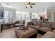 Spacious living room with tile flooring, neutral walls, and comfortable furnishings at 2773 Via Cipriani # 1310A, Clearwater, FL 33764