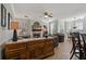 Open-concept living room with stylish furniture, tile flooring, and large windows with natural light at 2773 Via Cipriani # 1310A, Clearwater, FL 33764