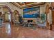 Opulent lobby showcasing a grand mural, marble floors, arched doorways, and elegant seating at 2773 Via Cipriani # 1310A, Clearwater, FL 33764