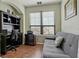 Bright office space with a futon, desk, and a large window overlooking the outdoors at 2773 Via Cipriani # 1310A, Clearwater, FL 33764