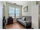Bright office space with a futon and a large window with natural light and calming decor at 2773 Via Cipriani # 1310A, Clearwater, FL 33764