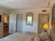 Bedroom featuring a neutral color scheme, closet, and a passthrough to the bathroom at 303 Meadow Ln, Oldsmar, FL 34677