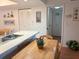 Bright kitchen and eating area with white countertop and wooden dining set at 303 Meadow Ln, Oldsmar, FL 34677