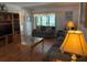 Cozy living room with comfortable seating, wood floors, and lots of natural light at 303 Meadow Ln, Oldsmar, FL 34677