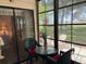 Enclosed patio offering great views of the backyard at 303 Meadow Ln, Oldsmar, FL 34677