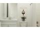Bright bathroom featuring vanity, sleek fixtures, art, and shower with subway tile at 31483 Cardinal Yard Dr, San Antonio, FL 33576