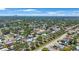 Wide aerial shot showcasing the neighborhood with lush trees and numerous homes at 3215 58Th N St, St Petersburg, FL 33710