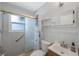 Bathroom with a tiled shower, shelves, and vanity at 3215 58Th N St, St Petersburg, FL 33710