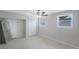 Bedroom featuring two windows, ceiling fan, and a closet at 3215 58Th N St, St Petersburg, FL 33710