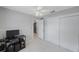 Bedroom with a ceiling fan, closet, and a view of the hallway at 3215 58Th N St, St Petersburg, FL 33710
