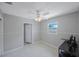 Bedroom with a window, ceiling fan, and an open closet door at 3215 58Th N St, St Petersburg, FL 33710