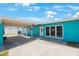 Stylish single-story home with a carport and a well-maintained front yard at 3215 58Th N St, St Petersburg, FL 33710