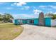 Charming home with a stone chimney and spacious front yard at 3215 58Th N St, St Petersburg, FL 33710