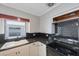 Updated kitchen featuring black appliances and subway tile backsplash at 3215 58Th N St, St Petersburg, FL 33710