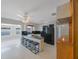 Spacious kitchen with breakfast bar and seating, with black appliances at 3215 58Th N St, St Petersburg, FL 33710