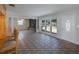 Spacious living room with a unique stone fireplace and large windows at 3215 58Th N St, St Petersburg, FL 33710