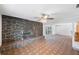 Open-concept living room featuring a unique stone fireplace and tile flooring at 3215 58Th N St, St Petersburg, FL 33710