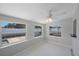Bright sunroom with large windows overlooking the backyard at 3215 58Th N St, St Petersburg, FL 33710