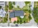 Gorgeous home featuring a backyard oasis and manicured lawn, complimented by lush landscaping and patio at 356 20Th Ne Ave, St Petersburg, FL 33704