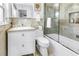 Bright bathroom with a white vanity, marble countertops, and a shower with glass doors at 356 20Th Ne Ave, St Petersburg, FL 33704