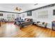 Spacious bedroom with hardwood floors, large windows, and decorative wallpaper accents at 356 20Th Ne Ave, St Petersburg, FL 33704