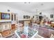 Open dining area with glass-top table, connecting multiple rooms at 356 20Th Ne Ave, St Petersburg, FL 33704