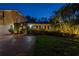 Exterior view of the home showing its manicured lawn and curb appeal at twilight at 356 20Th Ne Ave, St Petersburg, FL 33704