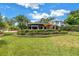 Lush landscaping surrounds this bright yellow home, enhancing its curb appeal at 356 20Th Ne Ave, St Petersburg, FL 33704