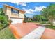 Two-story home with a two car garage, mature trees, and green lawn at 356 20Th Ne Ave, St Petersburg, FL 33704