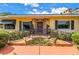 Charming home with a welcoming front porch, decorative ironwork, and colorful landscaping at 356 20Th Ne Ave, St Petersburg, FL 33704